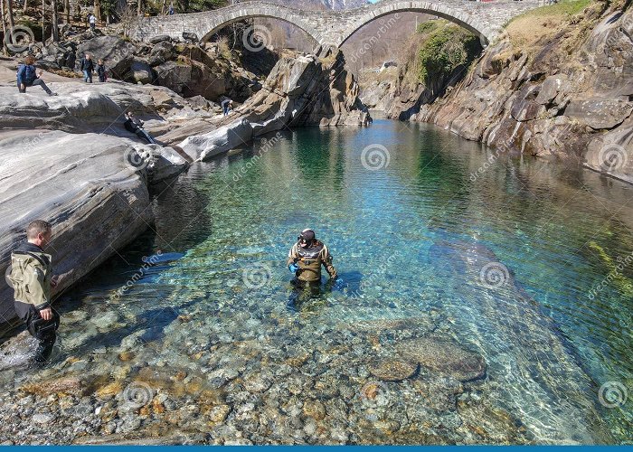 Lavertezzo Roman Bridge Tourists Visiting the Famous Roman Bridge of Lavertezzo on ... photo