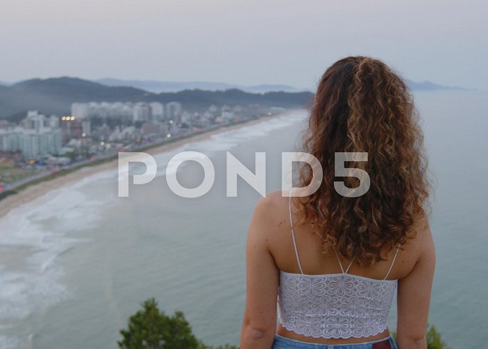 Careca Hill Adorable brazilian girl admiring the sun... | Stock Video | Pond5 photo